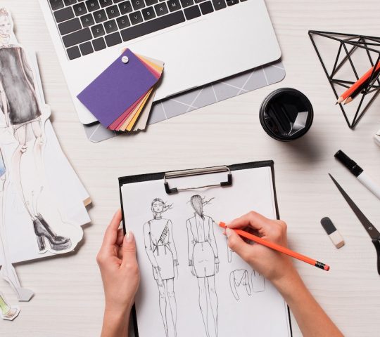 Student doing Fashion Designing sketch